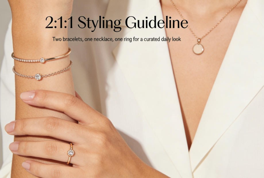 A person wearing jewelry following the 2:1:1 rule.